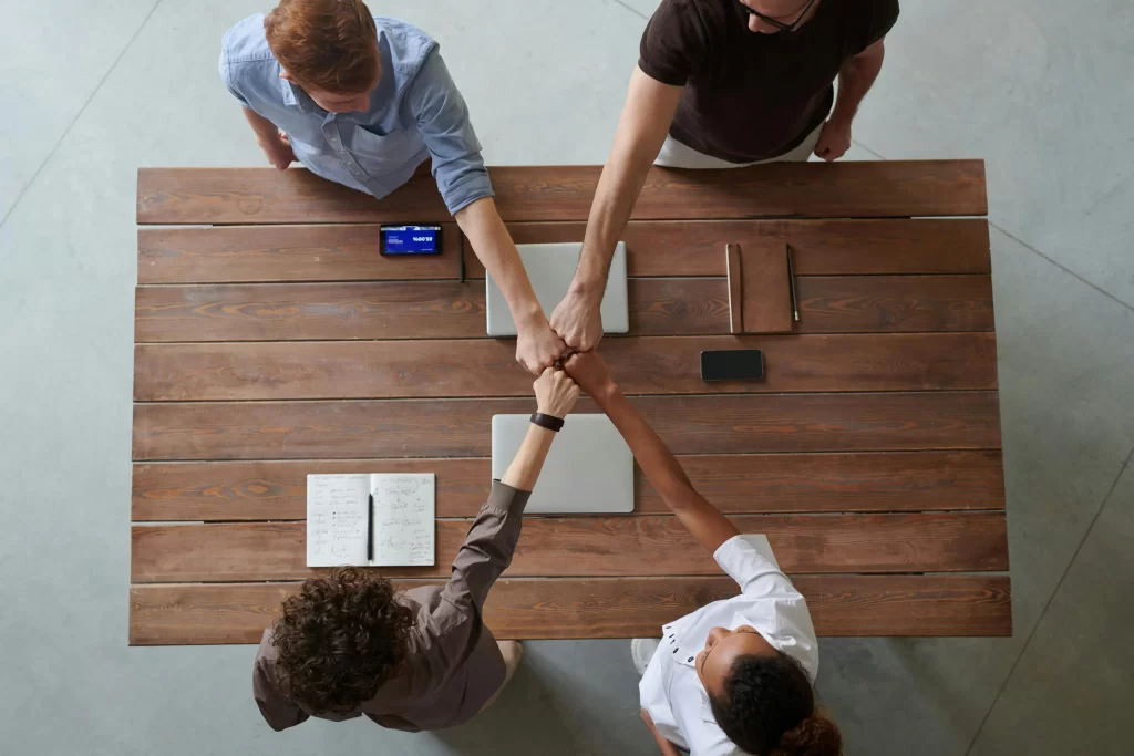 Client, Engagement, Teamwork, Communication, Fist Bump, Table